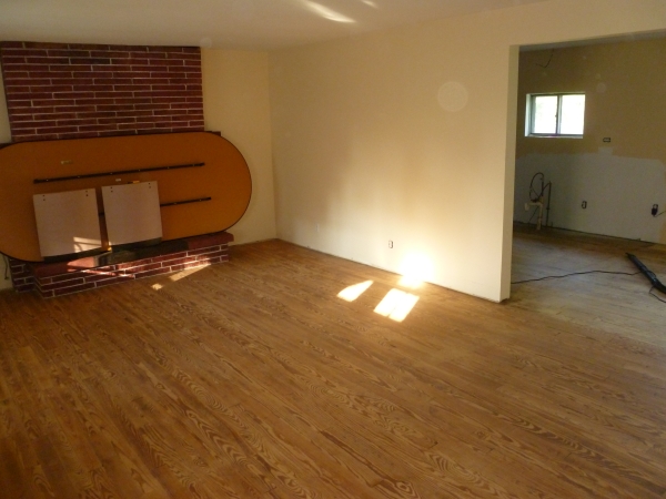 honey beige living room wall and maroon fireplace